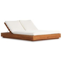 a wooden bed frame with white sheets on top of it and a mattress in the middle