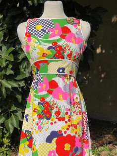 "Amazing Vintage Patty Woodard Bright Multicolored Floral Print Sleeveless Dress - Size S  Back zip closure  High waist  White trim No marked size. Please go by measurements. Measurements (laid flat, not doubled): Shoulder to shoulder: 11.5\" Underarm to underarm: 15.5\" Waist: 13\" Full length: 52\" Condition: great ! Feel free to message me with any questions before purchasing :)" Sleeveless Multicolor Dress For Garden Party, Multicolor Sleeveless Dress For Garden Party, Multicolor Print Sleeveless Dress For Spring, Multicolor A-line Sleeveless Dress With Floral Print, Sleeveless Multicolor Print Dress For Garden Party, Fitted Multicolor Dresses For Daywear, Multicolor Sleeveless Midi Dress With Floral Print, Multicolor Sleeveless A-line Dress For Garden Party, White Sleeveless Dress With Colorful Pattern