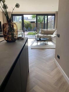 a living room filled with furniture and a large window