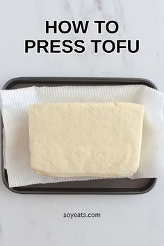 how to press tofu on a baking sheet with text overlay that reads, how to press tofu