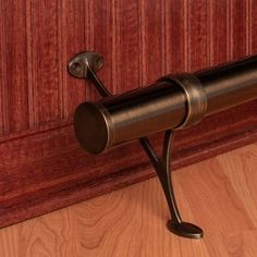 a close up of a door handle on a wooden door