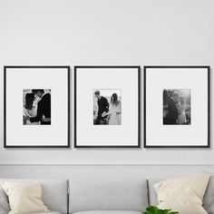 three black and white photos hang on the wall above a couch