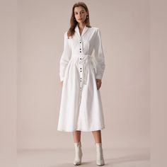 Details: - White - Work - Solid Color - Button - Pleated - A-Line - Lapel - Long Sleeves - Midi - Slim Fit - No Stretch - 65% Polyester, 35% Cotton - Machine Wash Or Professional Dry This Button Up Midi Dress Is A Perfect Choice For Any Occasion. The Long Sleeves, Lapel And A-Line Design Of The Dress Adds Movement And Flow, Making It Easy To Wear. The Button, Pleated And Contrast Stitch Detail Adds A Feminine Touch And Makes This Dress Perfect For Any Occasion. Whether You're Going Out On A Date Chic White Midi Dress With Button Cuffs, White Dress With Button Cuffs For Day Out, White Dresses With Button Cuffs For Day Out, White Midi Dress With Button Closure For Fall, White Button Closure Shirt Dress For Fall, White Button Shirt Dress For Fall, White Buttoned Midi Dress For Work, White Midi Dress With Buttons For Work, White A-line Midi Dress With Buttons