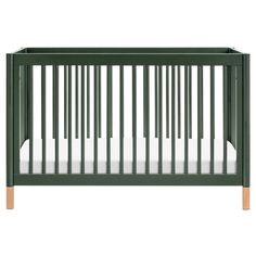 a green crib with white sheets on the bottom and wood trim around the sides