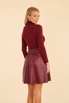 Featuring contrasting fabrics for a visually appealing yet effortlessly chic vibe, our Faux Leather & Knit Turtleneck Dress combines the comfort of a long-sleeved knit turtleneck with the modern edge of a sleek faux leather skirt. Pair it with a fur vest or coat, wool tights, and boots for a chic and cozy fall look. Available in Burgundy and Black. Knit and faux leather Long sleeves Turtleneck Available in Burgundy and Black Dry clean Style: 75652 Knit Turtleneck Dress, Black Turtleneck Dress, Wool Tights, Fur Top, Turtleneck Dress, Iconic Dresses, Knit Turtleneck, Wrap Cardigan, Long Sleeve Turtleneck