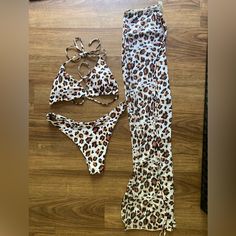 Leopard Print Bikini With Matching Sheer Coverup Pants Size Medium Worn Once - Like Brand New White Stretch Swim Sets, White Stretch Beachwear Bottoms, Fitted Tie-side Bottoms For Beach Party, Stretch Split Bottoms For Beach Season, White Stretch Bottoms For Beach Party, White Fitted Swimwear Set, White Fitted Bottoms For Beach Party, White Split Bottoms For Beach Season, Fitted White Bottoms For Beach Party