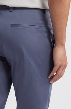 Part of your casual-day uniform, these chinos feature a slim, modern cut of stretch cotton for a comfortable fit. 31" inseam; 13" leg opening Zip fly with hook-and-bar closure Front slant pockets; back welt pockets 97% cotton, 3% elastane Dry clean Imported Modern Business Casual Blue Bottoms, Modern Blue Business Casual Bottoms, Modern Blue Bottoms For Business Casual, Modern Slim Fit Cotton Bottoms, Modern Slim Fit Cotton Pants, Fitted Cotton Dress Pants With Hip Pockets, Modern Blue Cotton Bottoms, Tapered Leg 4-way Stretch Chinos With Welt Pockets, Modern Tapered Leg Cotton Dress Pants