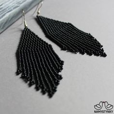 These minimalist black beaded earrings are made of high-quality Czech beads and strong synthetic thread. They are elegant, fashionable, and highly versatile, suitable for everyday wear. Features: Sterling silver components Color: Black. This item is currently in stock. You must be completely satisfied. If you find merchandise unsatisfactory for any reason, return it within 10 days and your money will be refunded without questions. More beaded earrings http://etsy.me/2ycItdb Gerdan necklaces http Elegant Tassel Earrings With Round Dangling Beads, Elegant Beaded Fringe Earrings, Elegant Beaded Fringe Chandelier Earrings, Elegant Fringe Beaded Earrings For Party, Elegant Beaded Fringe Earrings For Party, Elegant Black Fringe Chandelier Earrings, Black Fringe Tassel Drop Earrings, Elegant Black Beaded Chandelier Earrings, Black Party Chandelier Earrings With Dangling Beads