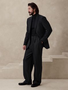 This relaxed pant is expertly cut with a wide leg and puddle hem in our signature Italian hopsack fabric, selected for its basketweave texture and exceptional drape.  Mid rise.  Wide leg with extra length for a break at the hem Responsible Wool Stand Minimalist Formal Outfit Men, All Black Fashion Men, Man All Black Outfit, Black On Black Tuxedo Wedding, Wide Leg Trousers Outfit Men, Black Suit Men Formal Classy, Wide Pants Outfit Men, Black Men Formal Outfit, Wide Leg Pants Outfit Men