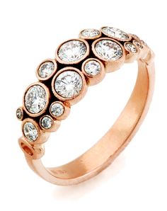 a rose gold ring with diamonds on it