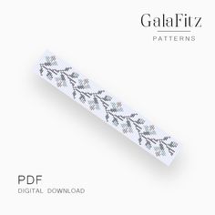 a white ribbon with black leaves on it and the words galafiz patterns printed on it