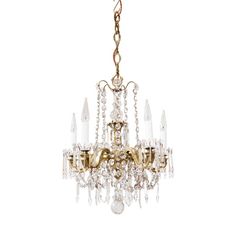 an antique chandelier with crystal drops hanging from it's golden frame and chain