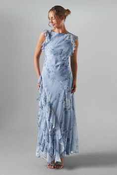 Inspired by the calming beauty of nature and influenced by a recent resurgence of ultra-romantic styles, this maxi dress is a standout choice for bohemian settings and countryside destinations. Featuring a soft chiffon ruffle sleeve detail and maxi length. Bridesmaid Dresses Pastel Blue, Pastel Blue Bridesmaid, Periwinkle Bridesmaid Dresses, Pale Blue Bridesmaid Dresses, Coast Bridesmaid Dresses, Mismatched Bridesmaid Dresses Blue, Black Tie Dress Wedding, Printed Bridesmaid Dresses, Light Blue Bridesmaid Dresses