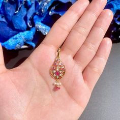 Featured is a pendant only made in 22k gold, studded with rubies and pearls. The pendant weighs 2.45 gms including 0.15 gms in the hanging ruby-emerald beads. The pendant is sold without the chain. Price Breakup Summary Component Rupees % of Total 22k Gold 11,385 78.5% Stones & Beads 653 4.5% Making Charges 2,049 14.1% Taxes (GST) 423 3.0% Total 14,509 100.0% View Detailed Price Breakup Yellow Gold Ruby Kundan Necklace Gift, Ruby Kundan Necklace In Yellow Gold, Ruby Kundan Necklace In Yellow Gold As Gift, 22k Gold Jewelry Necklaces, 22k Gold Jewelry, Pearl Necklace Set, Emerald Bead, Ruby Emerald, Gold Jewelry Necklace