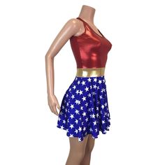 a female mannequin wearing a red top and blue skirt with white stars on it