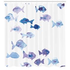 a shower curtain with blue and purple fish on it