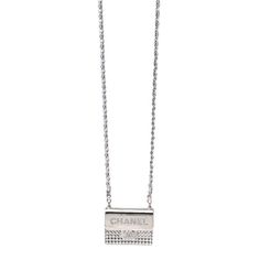 This is an authentic CHANEL Metal Lambskin Strass Crystal Purse CC Long Necklace in Silver. This mini silver crystal purse features a long sliver chain link metallic leather strap and crystal-set Chanel CC logos. Chanel Long Necklace, Luxury Silver Necklace For Evening, Luxury Silver Chain Jewelry For Evening, Elegant Silver Necklaces With Silver-tone Logo Plaque, Elegant Silver Necklace With Silver-tone Logo Plaque, Luxury White Gold Necklaces With Rhinestones, Luxury White Gold Necklace With Rhinestones, Luxury Everyday Silver Necklaces, Luxury Silver Necklaces For Everyday