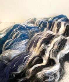 some blue and white hair sitting on top of a table