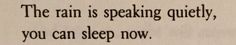 an old typewriter with the words the rain is speaking quietly, you can sleep now