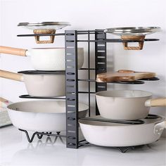 a rack with pots and pans on it