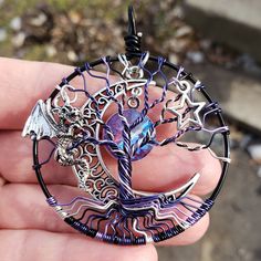 "✩ Get an instant 30% off this item when you join my Free Tree Tribe VIP Club here: http://eepurl.com/bC6Vhr I promise not to spam Nox Dragon Tree of Life Pendant This Nox Dragon Tree of Life Pendant is created by hand with painstaking detail. Each wire is delicately wrapped to produce a detailed design. All materials are lead and nickel free to include the permanently colored copper wire, charms, and genuine Swarovski crystal. Nox is Latin for night. This dragon pendant represents the night sky Steampunk Tree Of Life, Wire Charms, Copper Wire Art, Wire Wrapped Stone Jewelry, Dragon Tree, Wire Wrap Jewelry Designs, Life Jewelry, Wire Wrapped Jewelry Diy, Purple Dragon