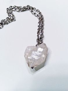 Unique large Herkimer diamond quartz crystal necklace. Natural asymmetrical heart like shape. 💖Every side is different on this unique piece.  Sparkling cut stainless steel chain with lobster claw clasp. Stainless chain measures 18 inches long. Herkimer diamonds are not actually diamonds but are double-terminated quartz crystals discovered in outcrops of dolostone in and around Herkimer County, New York and the Mohawk River Valley. The "diamond" in their name is due to both their clarity and natural faceting - crystals possess double termination points and 18 total faces (six on each point, six around the center. I only use high-quality stainless-steel jewelry findings, and heavy-duty stainless jump rings and connectors. Links can be added for free if you need a larger size or a custom sma Gift Herkimer Diamond Necklace In Silver, Silver Quartz Necklaces With Raw Stone, Silver Quartz Necklaces With Raw Stone Detail, Silver Herkimer Diamond Jewelry As Gift, Silver Gemstone Heart Pendant Crystal Necklace, Silver Heart Pendant Crystal Necklace With Gemstone, Quartz Crystal Necklace, Diamond Quartz, River Valley