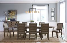 a dinning room table with chairs around it