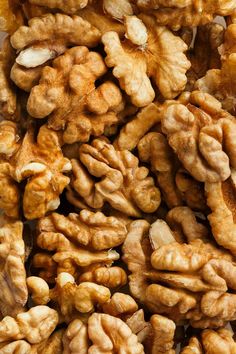 walnuts are piled on top of each other and ready to be eaten for consumption