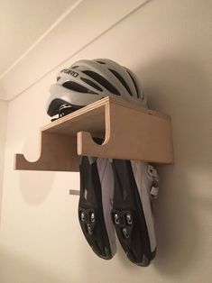 there is a helmet and pair of skis hanging on the wall