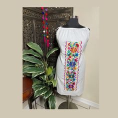 "Beautiful hand embroidered dress! This has been made and brought directly from Chiapas, Mexico. The embroidery is 100% handcrafted. All the work on this dress has a professional skilled finish and the multicolor embroidered makes it look even more eye catching. The embroidery work is made with great quality thread. The eye catching will be on the embroidered work, which is exquisite looking. Beautiful and clean work! Very light weight and fresh looking. SINCE THESE ARE EACH HANDMADE, EMBROIDERY Multicolor Cotton Dress With Embroidered Neckline, Sleeveless Dress With Multicolor Embroidery And Embroidered Hem, Folk Style Sleeveless Dress With Multicolor Embroidery, Multicolor Cotton Embroidered Dress With Embroidered Hem, Cotton Dress With Multicolor Geometric Embroidery, Multicolor Geometric Embroidered Cotton Dress, Traditional Multicolor Sleeveless Embroidered Dress, Traditional Multicolor Embroidered Sleeveless Dress, Folk Style Embroidered Dress With Multicolor Hem