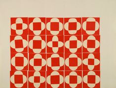 a red and white print with circles on it's side, in the center