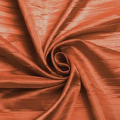 an orange fabric that is very shiny