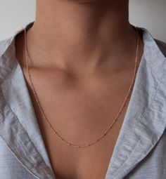 One of our favorite necklaces is the beaded satellite chain. This delicate curb chain is dotted with tiny 2mm beads every 14mm. We love this chain as a single or wrapped around twice as a double. Choose your own perfect length. Details: 14k solid gold chain 14k solid gold clasp * in the images you can see the necklace as a 14, 16,18 and 36-inch examples. The double wrapped necklace is 36 inches. We take pride in offering our customers the very best in fine jewelry. That's why we create stunning Delicate Satellite Chain Necklace For Everyday, Dainty Rose Gold Chain Necklace For Layering, Minimalist Rose Gold Chain Necklace For Layering, Minimalist Station Necklace With Delicate Chain For Layering, Minimalist Satellite Chain Necklace For Layering, Dainty Cable Chain Necklace, Dainty Cable Chain Station Necklace As Gift, Dainty Station Necklace With Cable Chain As Gift, Dainty Station Necklace With Cable Chain For Gift