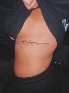 the back of a woman's stomach with an inscription on it that says, everything happens