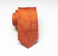 "This trendy skinny tie is made of a 100% silk, all new material. It measures 58\" long and 2\" at the widest point." Elegant Orange Tie For Business, Orange Formal Suit And Tie Accessories, Elegant Orange Suit And Tie Accessories For Formal Occasions, Formal Paisley Print Ties, Stock Tie, Tie Matching, Rustic Orange, Bright Wedding, Orange Tie