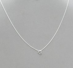 These are new hand crafted necklaces. The heart pendants are silver plated or gold plated, they measures 10mm x 10mm. The hearts float on a 1.3 mm silver or gold plated tiny flat curb chain, with a lobster clasp closure. You can choose the finish and the length you want from the drop downs. Any questions please convo me. Minimalist Adjustable Heart Charm Necklaces, Minimalist Charm Necklace With Heart Pendant, Minimalist Necklace With Lobster Clasp For Valentine's Day, Minimalist Lobster Clasp Necklace For Valentine's Day, Adjustable Heart-shaped Sterling Silver Charm Necklace, Adjustable Heart Charm Necklace In Sterling Silver, Adjustable Sterling Silver Open Heart Necklace, Sterling Silver Heart Charm Necklaces, Texas Necklace