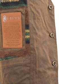 Product Description: This garment features a breathable design, button-down closure, insulated material, a security pocket, and warming properties. It is also waterproof and made with primary oilskin material, specifically for men. Care instructions include cleaning with a dry brush, washing with water only, and re-oiling once a year for waterproofing. This vest is suitable for a western or workwear lifestyle, with a 12oz oilskin fabric and other notable features such as besom pockets, inside po Utility Outerwear With Patch Pockets For Outdoor, Rugged Utility Jacket With Button Closure For Outdoor, Rugged Outdoor Work Outerwear With Pockets, Military Style Waterproof Hunting Outerwear, Rugged Outerwear With Pockets For Outdoor Work, Rugged Cotton Hunting Outerwear, Rugged Cotton Outerwear For Hunting, Outdoor Brown Utility Jacket With Snap Buttons, Brown Utility Jacket With Snap Buttons For Outdoor