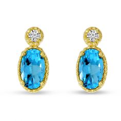 Vibrant blue oval blue topaz is the centerpiece of these beautiful stud earrings. Delicate milgrain adds an elegant interest to the 14k yellow gold design. These dreamy December birthstone earrings are a lush addition to any jewelry collection. Blue Oval Earrings With Diamond Accents, Blue Topaz Oval Earrings, Blue Oval Topaz Earrings, Gold Oval Blue Topaz Earrings, Classic Yellow Gold Blue Topaz Earrings, Classic Blue Topaz Yellow Gold Earrings, Blue Oval 14k Gold Earrings, Oval Blue 14k Gold Earrings, Oval Gold Topaz Earrings