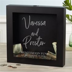 a black frame with money in it and the words varese and prestoar written on it