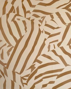 the wall is painted with brown and white stripes on it's surface, as if in an abstract manner