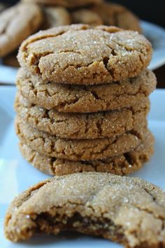 a stack of cookies sitting on top of a white plate