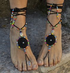 This listing is for a pair of black gipsy mandala barefoot sandals. Beautiful and unique barefoot sandals with a tribal vibration. Handmade crocheted with love and care using black waxed polyester cord, tibetan silver beads and czech seed beads. They will embellish your feet and you can wear it with sandals in a variety of styles from work to casual to evening attire. Beautiful to wear on a beach or garden wedding. Great and very comfortable for making yoga, hula hoop, belly dance and dancing. T Summer Festival Jewelry With Black Beads, Adjustable Traditional Anklets For Party, Black Beads Summer Beach Jewelry, Summer Beach Jewelry With Black Beads, Handmade Anklets For Festivals And Parties, Traditional Beaded Barefoot Sandals For Party, Black Bohemian Jewelry For Beach, Black Bohemian Anklets With Black Beads, Black Beaded Festival Anklets