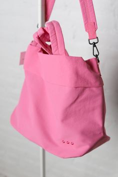 Meet your new BFF - the Carrie Catch All Shoulder Tote Bag! This trendy athleisure bag is perfect for gym days, running errands, or just looking stylish on the go. Comes in multiple colors including black, white, fuchsia, and lilac. Includes a removable strap, inner zipper pocket, and middle divider that also has a zipper pocket for all your essentials. Plus, a latch closure for extra security. Versatile Everyday Pink Bag, Functional Pink Everyday Bags, Pink Nylon Gym Bag, Functional Pink Shoulder Bag For Daily Use, Functional Pink Bag For Everyday Use, Sporty Pink Shoulder Bag For Daily Use, Sporty Pink Bag For Sports, Functional Pink Bags With Adjustable Strap, Functional Pink Bag With Adjustable Strap