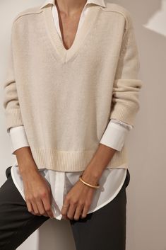 Classic Oversized V-neck Top, Effortless Layering Blouse For Fall, Effortless Fall Layering Blouse, Classic V-neck Top For Layering, Effortless V-neck Blouse For Fall, Effortless Fall V-neck Blouse, Fall Season Relaxed Fit Blouse For Layering, Timeless Relaxed Fit Tops For Spring, Classic Neutral Tops For Layering