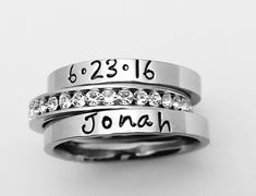 "This GOREOUS 3 mm ring is super shiny, solid stainless steel. Great for stacking. The surface is flat, so the lettering really stands out! Add names, initials, dates, quotes, roman numerals or scripture. I have the heart, double heart, infinity, #, &, @, !, =, *, :, ?, cross, baby foot, angel, and ribbon stamps. Made of solid surgical Stainless steel which will never rust, tarnish, change color and is hypoallergenic. I ONLY stamp on the outside of the rings. I hand stamp each letter, then u Custom Name Adjustable Stackable Wedding Rings, Custom Name Rings For Mother's Day Promise, Custom Name Promise Ring For Mother's Day, Custom Name Adjustable Stackable Rings For Personalized Gift, Adjustable Stainless Steel Stackable Rings As Promise Rings, Adjustable Stainless Steel Stackable Rings For Promise, Stainless Steel Stackable Promise Ring, Personalized Stainless Steel Promise Ring, Personalized Stainless Steel Engraved Promise Ring