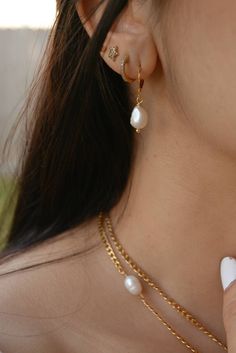 These small pearl drop hoops earrings are perfect for a classic and elegant look, they are made of 18k gold plated stainless steel. I particularly love these earrings for a bride/wedding occasion! Sold in pairs ITEM DETAILS Water Resistant- skin-friendly-Tarnish-free Material: 18k Gold plated stainless steel hoops Freshwater Pearls **Sizes: Small Hoop Diameter 0.59 in - 15mm Jewelry Care We at Alma Libre Jewelry understand that every person is different and we each have unique skin-oils that may Teardrop Pearl Drop Huggie Earrings, Teardrop Hoop Earrings With Pearl Charm, Gold Plated, Classic Pearl Chain Hoop Earrings Gift, Classic Hoop Earrings With Pearl Chain For Gift, Classic Gold Plated Hoop Earrings With Pearl Drop, Teardrop Gold Plated Pearl Earrings, Classic Gold-plated Hoop Earrings With Pearl Drop, Elegant Gold Plated Huggie Earrings With Pearl Drop, Elegant Gold-plated Huggie Earrings With Pearl Drop