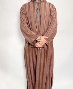 Beautiful moroccan kaftan for men Beautiful moroccan kaftan in cotton for men. This moroccan clothing is handmade in soft fabric cotton. This kaftan is very pleasant to wear mainly in summer, at the beach, after a spa, indoor, outdoor, at a party... Very fast to wear, not stick to the skin, this kaftan is a really must have clothing. This bohemian kaftan fits all body shape perfectly. - Cotton - embroidery - Machine washing We now use DHL/FedEx companies for shipping, please send us your phone n Long Sleeve Thobe For Eid, Festive Long Brown Kaftan, Elegant Brown Long Sleeve Thobe, Traditional Long Sleeve Agbada With Dabka, Eid Brown Dabka Kaftan, Traditional Brown Abaya For Eid, Traditional Long Sleeve Thobe For Festive Occasions, Long Sleeve Abaya For Eid Ceremonies, Bohemian Long Sleeve Agbada For Eid