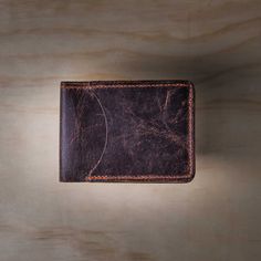 Sometimes you only need to carry the essentials.Handcrafted in the USA from the same North American Steerhide as the Tahoe Bifold Wallet, the scaled-down Slimline Bifold holds up to 8 credit cards and your currency in its small bill compartment.The perfect minimalist wallet for those who appreciate top quality materials and design. Tanned North American Steerhide. As the leather ages, the patina develops its own unique characteristics. Dimensions Closed 3-7/8" x2 7/8" Open 7 ½" 2 7/8" - Approx w Bifold Wallets For Daily Use, Brown Rectangular Wallet With Waxed Finish, Rectangular Wallets With Waxed Finish For Everyday Use, Classic Handmade Wallet For Everyday Use, Brown Rectangular Trifold Wallet With Waxed Finish, Classic Bifold Wallets With Waxed Finish, Bifold Waxed Finish Wallets For Everyday Carry, Rectangular Trifold Wallet With Card Slots, Everyday Rectangular Trifold Wallet With Coin Pocket