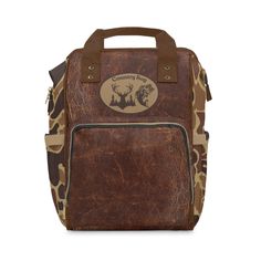 a brown backpack with an animal print on it