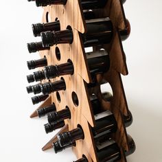 a wooden wine rack filled with lots of bottles